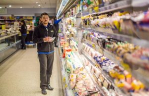 Staff at the refrigerated aisle