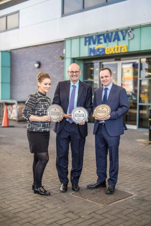 the management team, including Frank Hagan (centre) with their trio of awards