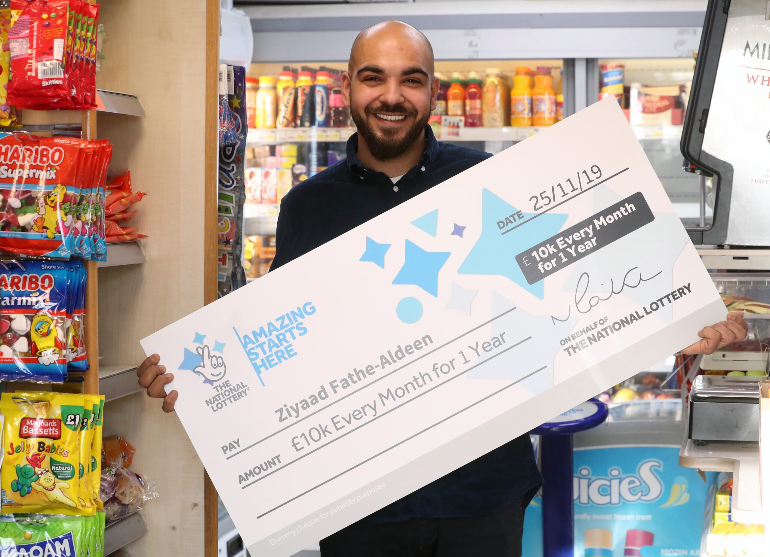 Shop assistant wins £10,000 a month for a year and plans world tour